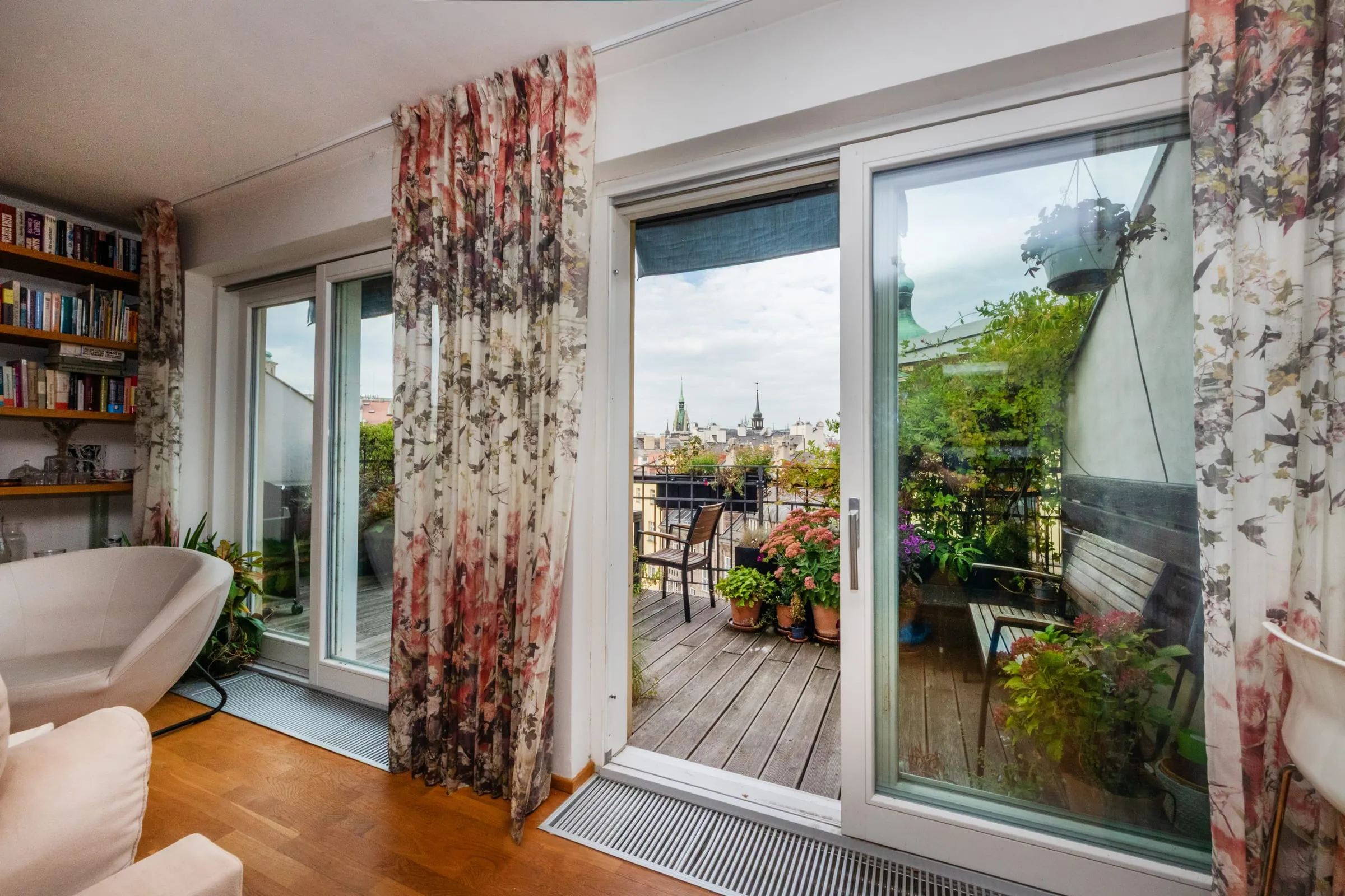 Entrance to the terrace through designer curtains